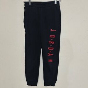 Air Jordan Kids Black Joggers with Red Lettering size L